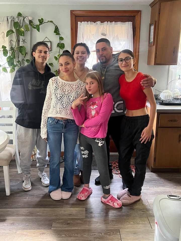 Miguel with his family at home in Davenport
